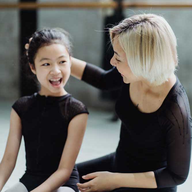Young dancer with her teacher.