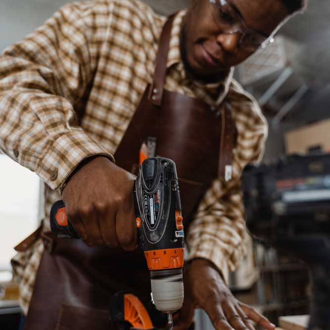 Volunteer with a drill.